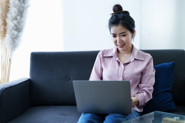 istock Portrait of a self-employed Asian woman using a computer at home 1436563333