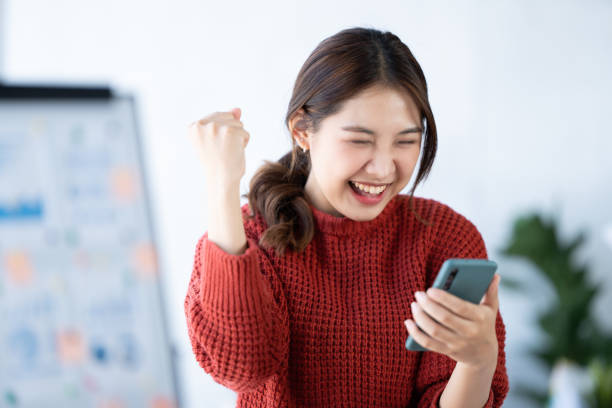 istock Young asian woman using a smart phone. 1436563340