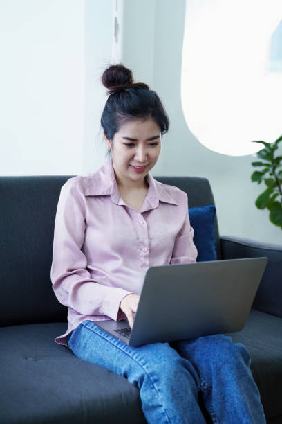 istock Portrait of a self-employed Asian woman using a computer at home 1436563388
