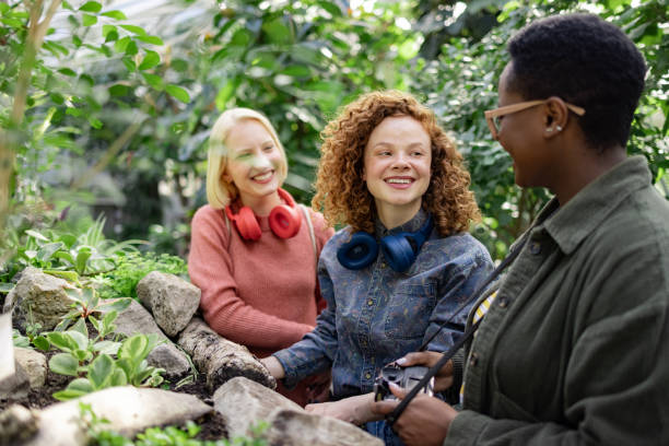 istock Multicultural friends having fun at botanical garden 1436563888