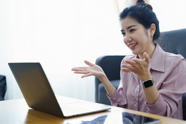 istock Portrait of a self-employed Asian woman using a computer doing video conference at home 1436564076