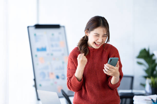 istock Young asian woman using a smart phone. 1436564423
