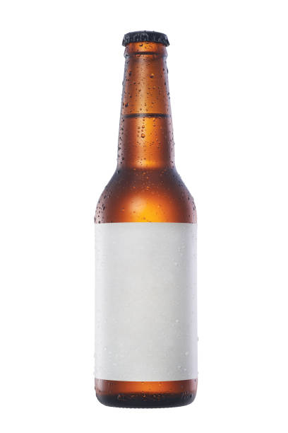 Bottle of beer with drops and white empty label isolated on white background stock photo