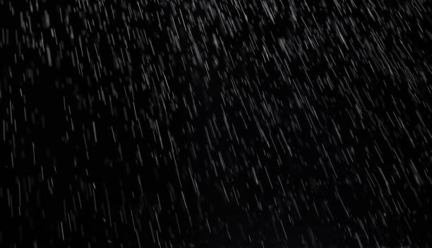 éclaboussures abstraites de pluie et de neige figer le mouvement des particules blanches sur fond noir - calque photos et images de collection