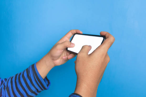 istock young man playing games indoor 1436568396