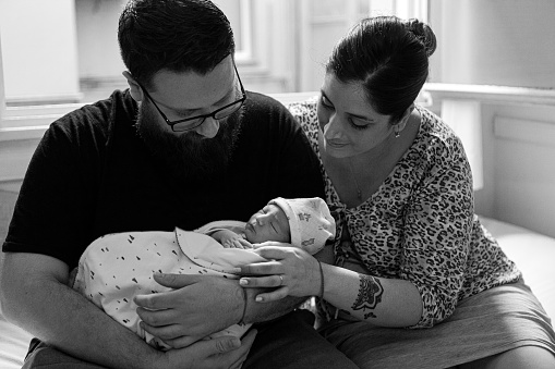 One day newborn baby boy with mother and father at hospital