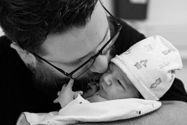 istock Father holding his newborn baby 1436569010