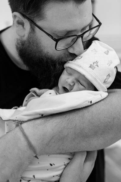 istock Father holding his newborn baby 1436569019