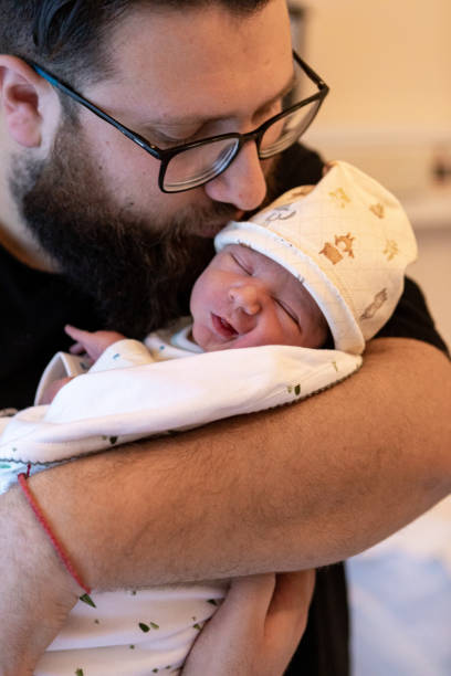 istock Father holding his newborn baby 1436569052