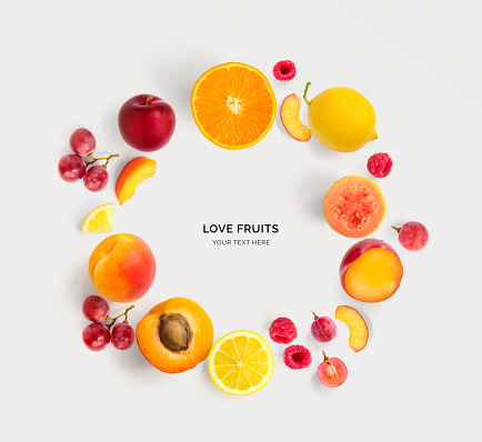 Creative layout made of various fruits with white paper card. Flat lay. Food concept.
