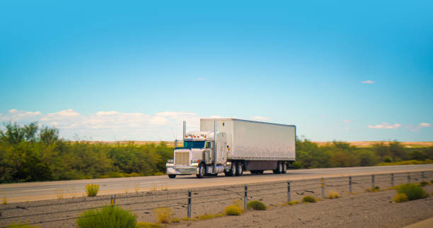 istock White truck transporting merchandising in Texas, USA 1436574505