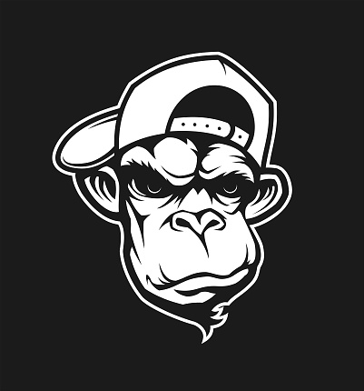 Stylized cut out vector silhouette of an angry gorilla, ape or monkey head in a baseball cap