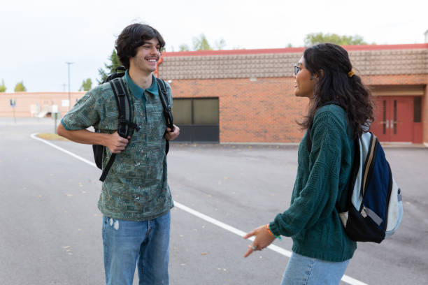 istock College students outside of a school building. 1436578889
