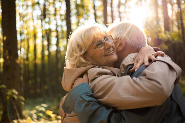 istock Senior couple on a romantic walk. They are hugging. 1436578972