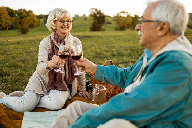 istock Senior couple enjoyig a wine 1436579053