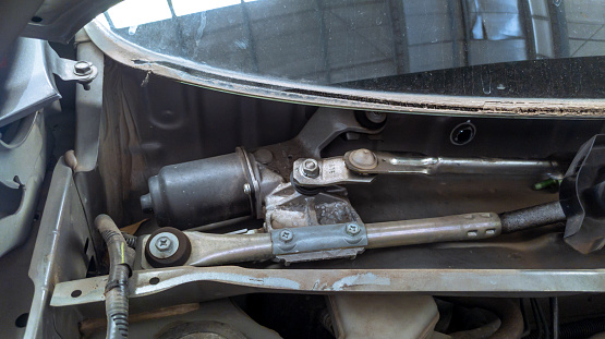 windshield wiper motor drive assy mounted on a car