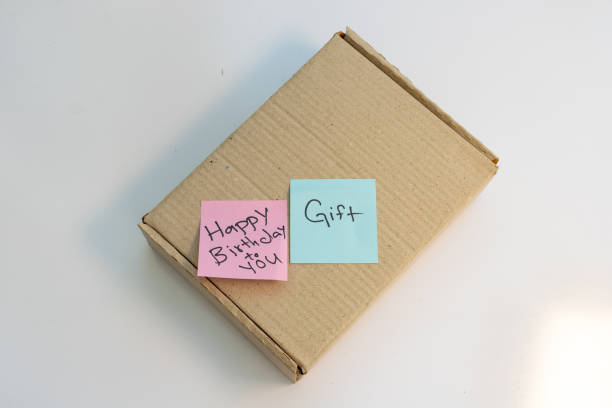 Parcel box with a text note of happy birthday and gift
