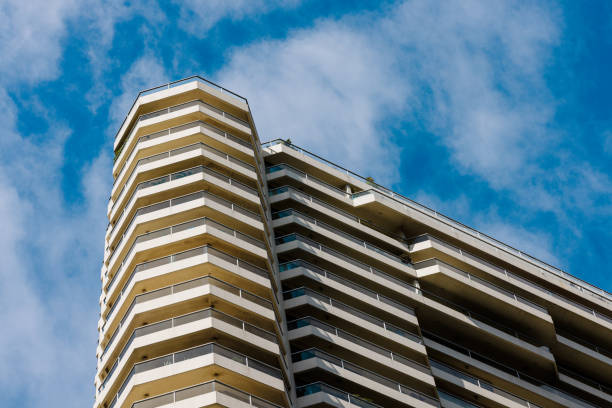 Detail of a tall city building with overcast sky.