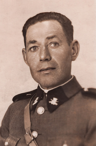 Black and white image taken in the 40s: Spanish Civil guard mid adult man portrait