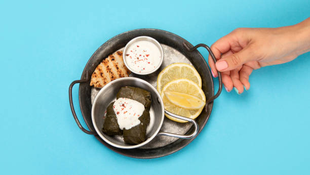 Greek food assortment on color background.