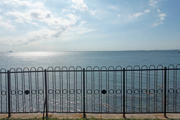 Wooden fence with sea below
