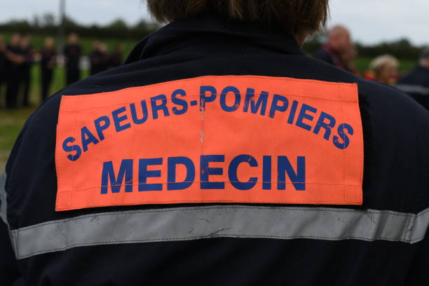 istock Back of a doctor specialized in emergency situations such as natural disasters. Equipped with a high visibility jacket for quick identification of each member of the intervention team 1436598410