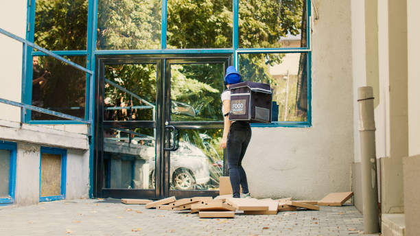 istock Fast food courier trying to catch falling pizza boxes 1436600269