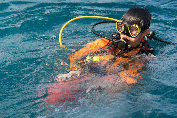 istock Asian Chinese boy prepares for scuba dive 1436601957