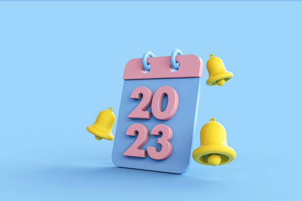 istock New year resolution 2023. Yellow notification bell ringing and calendar deadline on blue background. 3d rendering. 1436605426