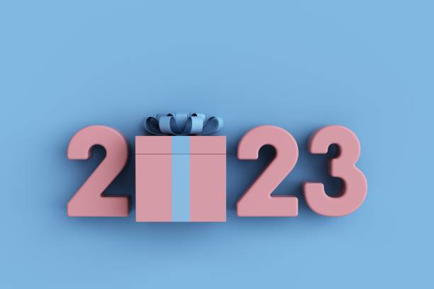 istock 2023 And Pink Gift Box Sitting Behind On Blue Background. 1436605450