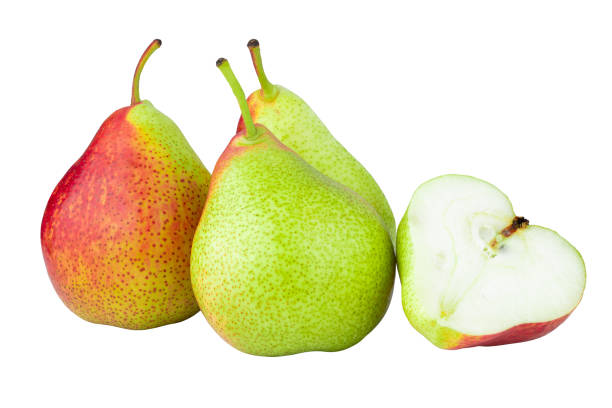 istock Green pears cut in half and sliced to pieces separately isolated over white background 1436606573