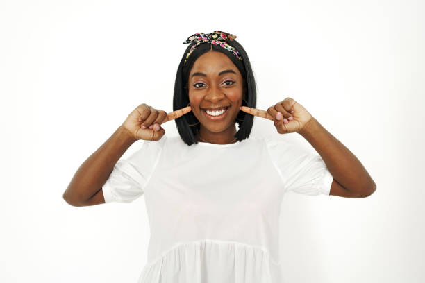 istock Beautiful young african woman posing over white background 1436612850