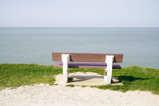 wooden bench back view in french bay of bassin Arcachon in cap ferret city France