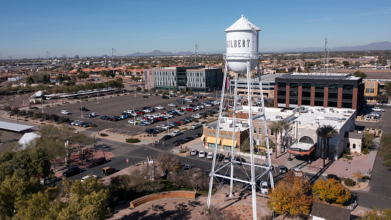 Gilbert, Arizona, USA - January 4, 2022: Sunlight shines on the historic downtown water tower of downtown Gilbert.