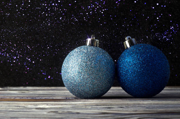 Christmas decorations in blue on a wooden background