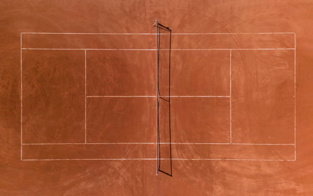Aerial view of empty clay tennis court on a sunny day Aerial view of empty clay tennis court on a sunny day clay court stock pictures, royalty-free photos & images