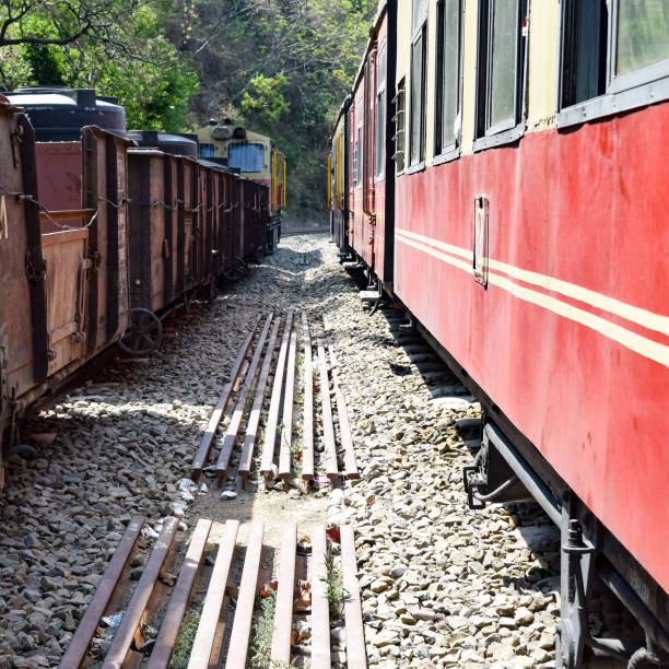 istock Toy Train moving on mountain slopes, beautiful view, one side mountain, one side valley moving on railway to the hill, among green natural forest. Toy train from Kalka to Shimla in India, Indian Train 1436620179