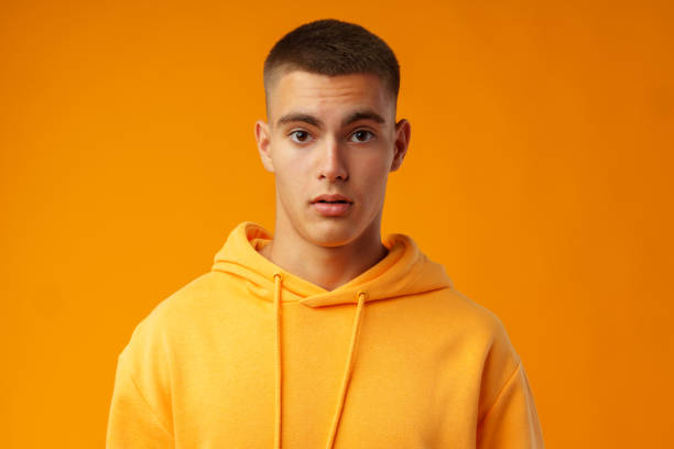 istock Young handsome man shocked with surprise expression standing over yellow background 1436622999