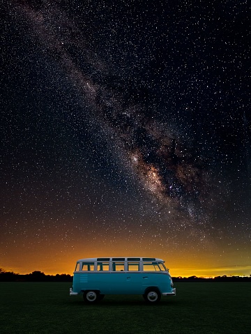California City, Mexico – August 22, 2022: Vintage camper bus alone on a starry night with Milky Way Sky , 3d illustration