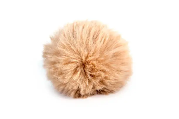 Fur ball isolated on white background. Fluffy Brown of fur ball