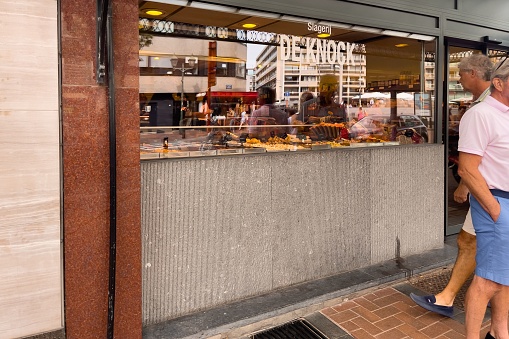 Knokke, Belgium – September 01, 2022: People walking nearby a bakery entrance