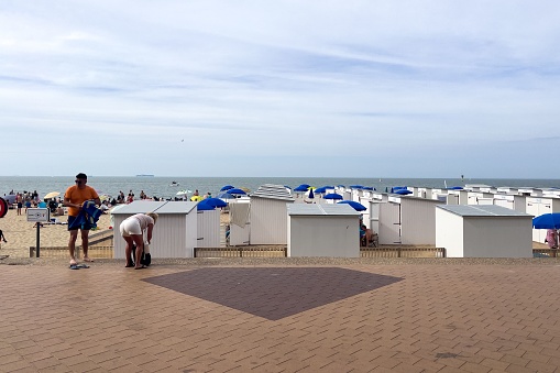 Knokke, Belgium – September 01, 2022: A white beach huts on the beach in the small Belgian town of Knokke-Heist