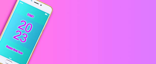 istock Smartphone. 2023 Start. Pink background. Festive banner. copy space. Festive background. 1436626000