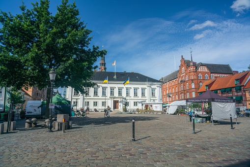 Ystad, Sweden – August 23, 2022: A small town square with tents selling various things on a sunny summer day in Ystad, Sweden.