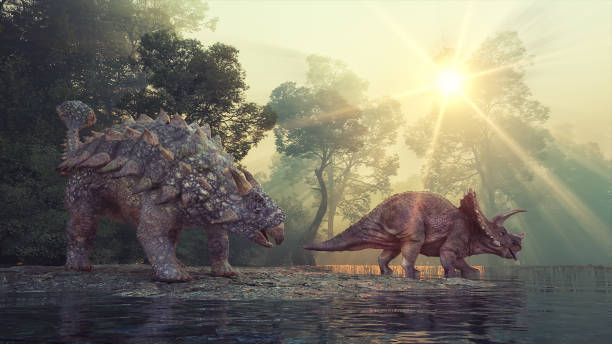 Ankylosaurus and Triceratops in the valley at the lake. stock photo