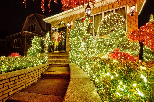 New York, United Kingdom – December 27, 2021: A house in the Dyker Heights neighborhood decorated with colorful and bright Christmas lights