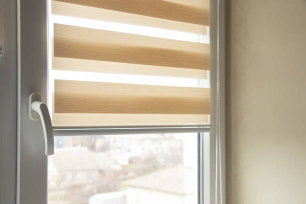 istock beige blinds day night on the kitchen window close-up 1436634213