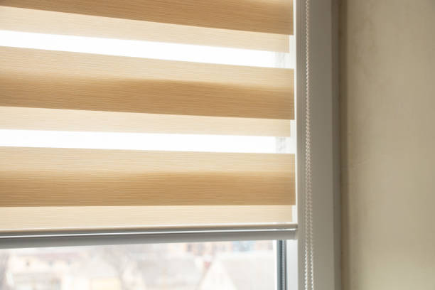 istock beige blinds day night on the kitchen window close-up 1436634363