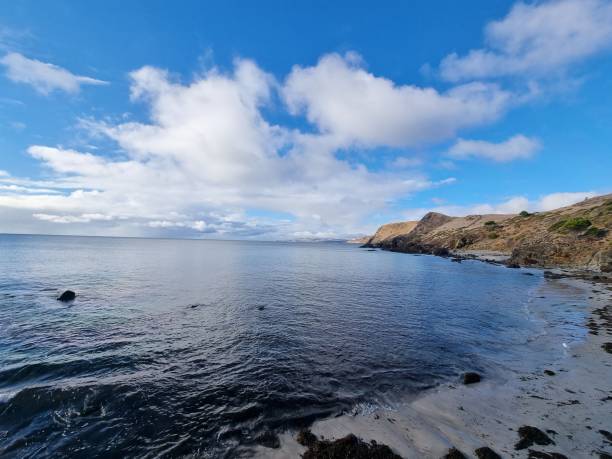 istock Scenic beach shoreline with shallow water approaching the sand 1436635543