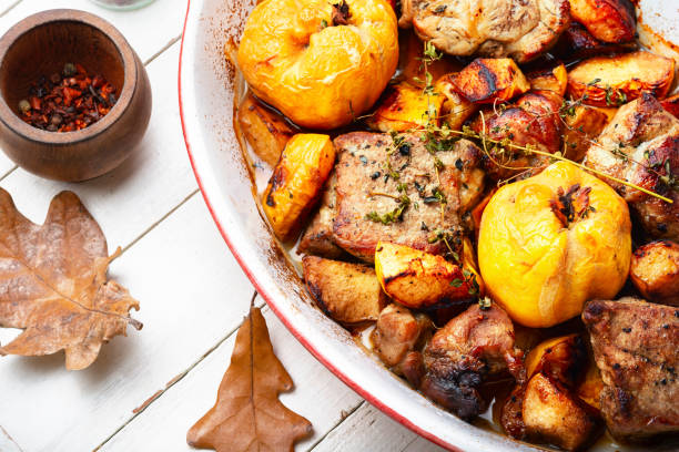Pork cooked with autumn quince. stock photo